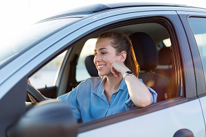 young woman driving car